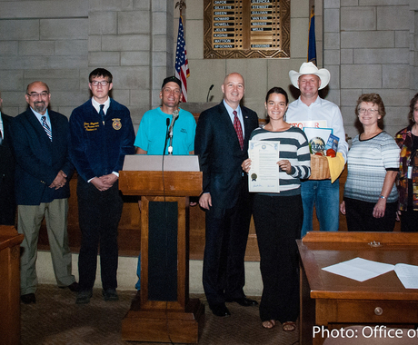 Group of folks with governor and proclamation