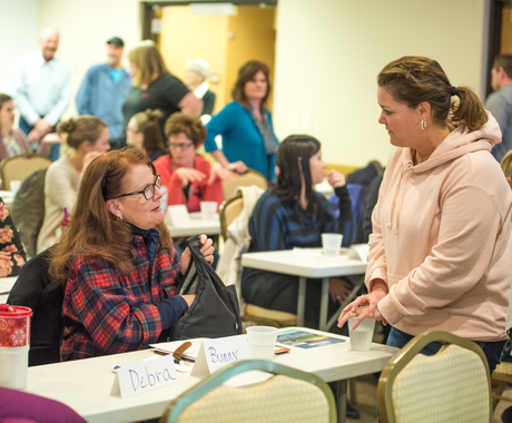 Two women networking at a workshop
