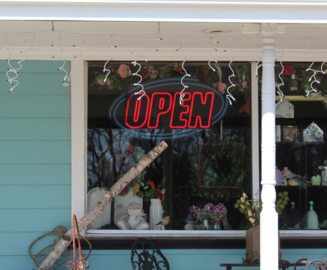 Front window of business with open sign