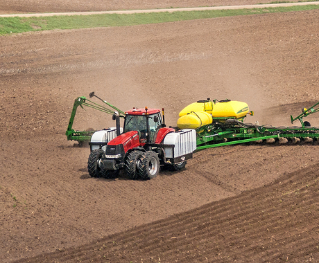 Tractor planting crops