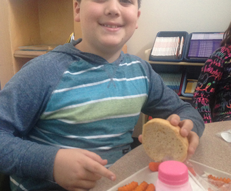 Boy eating school lunch
