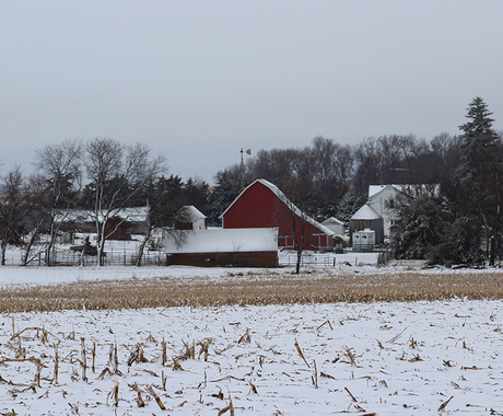 Small farm in a dusting of snow