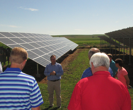 People on a tour to look at solar panels