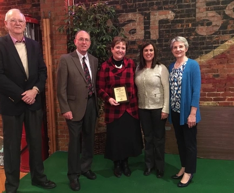 Two men and three women with award