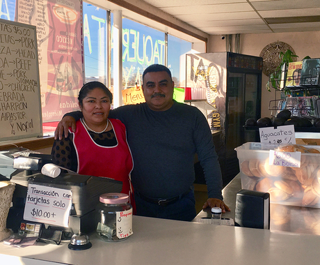 Woman and man business owners in restaurant