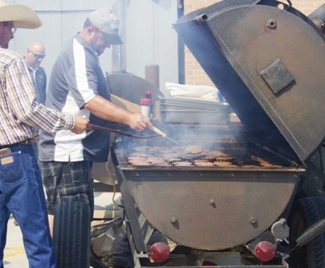 Two men at grill