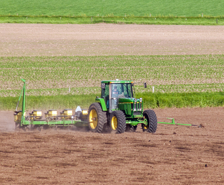 Tractor planting crops