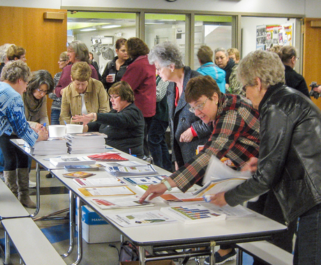 Group of cafeteria workers signing in to workshop
