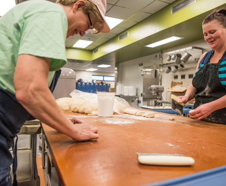 Cafeteria workers making bread