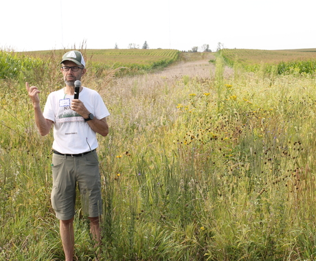Lee Tesdell speaking in field 