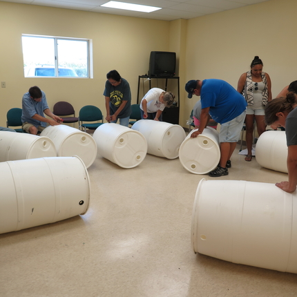 Folks building rain barrels