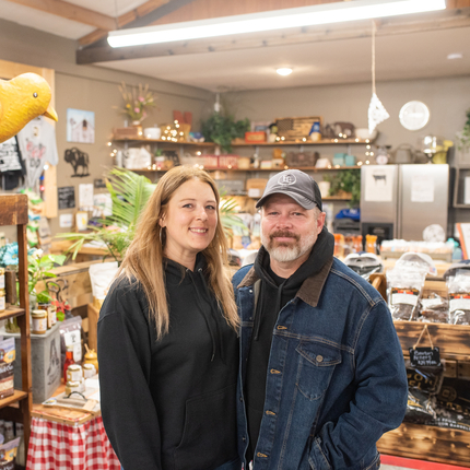 Amber and Tony Ellsworth stand in their store surrounded by local products