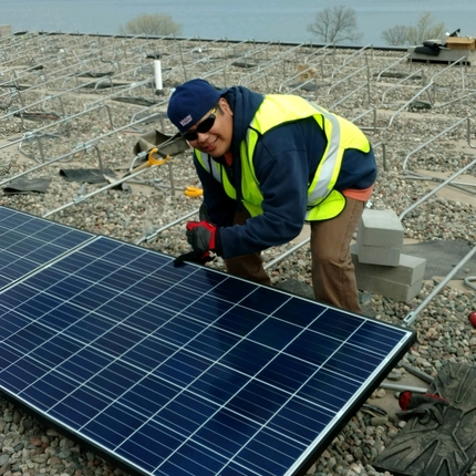 Man working on a solar panel 