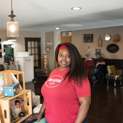 Woman stands in coffee shop