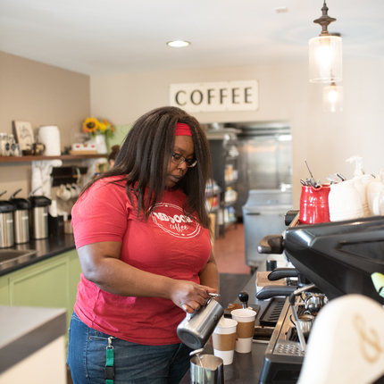 Barista making coffee