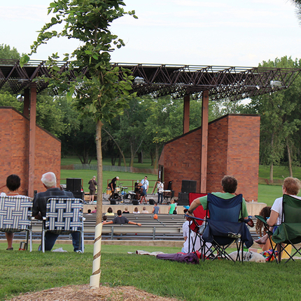 Folks in lawn chairs watching a concert
