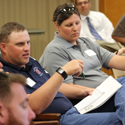 Man speaking in group at conference