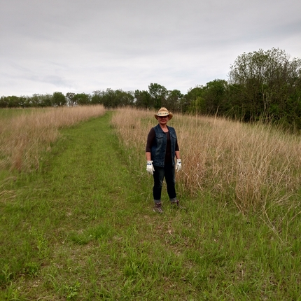Ann Wolf standing in prairie