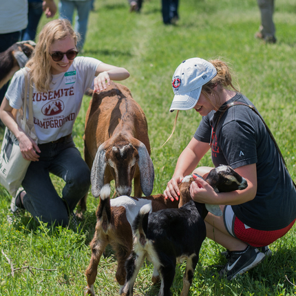 Two young women and goats