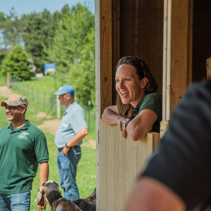 People in and around barn