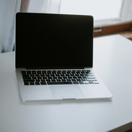 laptop computer sitting on a desk.