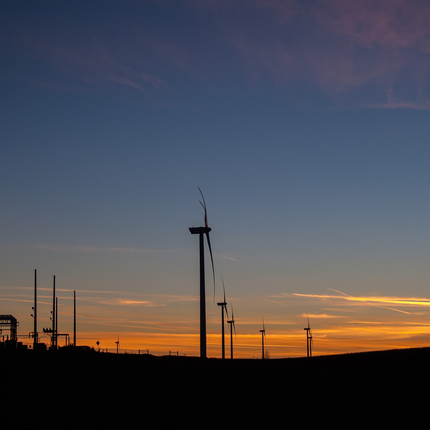 Wind towers at sunset