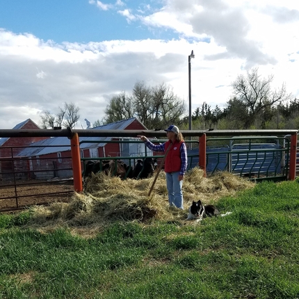 Woman with dog on farm