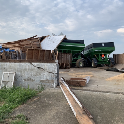 Combine in wind damaged shed