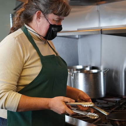 Renee Cornett giving a tour of the kitchen at Lakehouse Farm