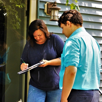 Center staff taking signatures