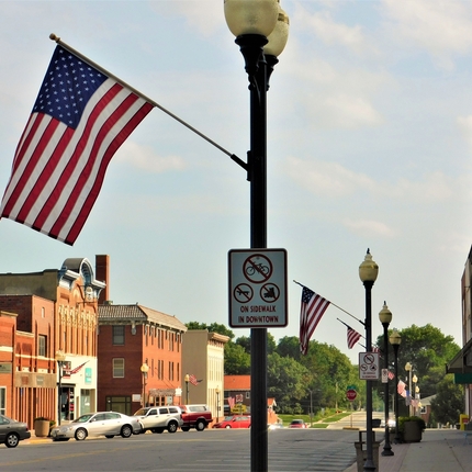American flags on a downtown main street