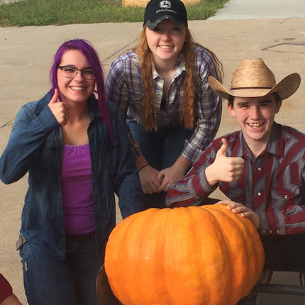 Students with giant pumpkin