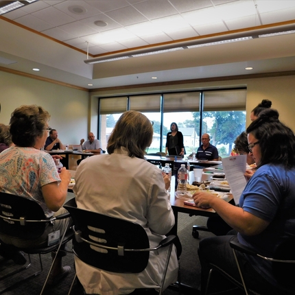 Community members meeting about Medicaid expansion 
