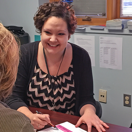 Woman working with client