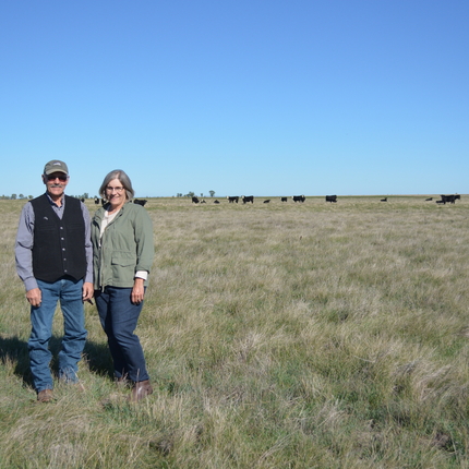 Mel and Jan Gimbel in a field. 