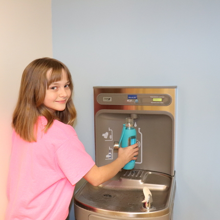Student at water fountain