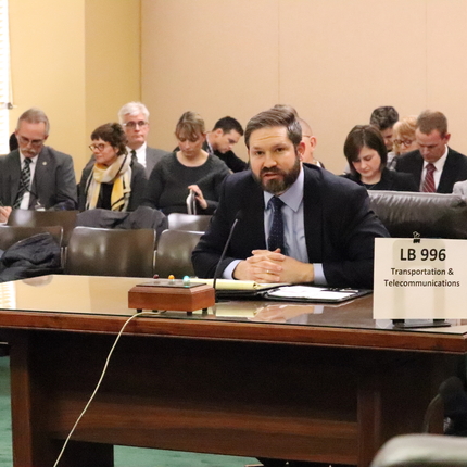 Man testifying at state legislative hearing