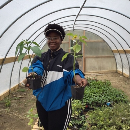 Woman in greenhouse