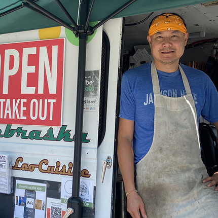 man posing in food truck