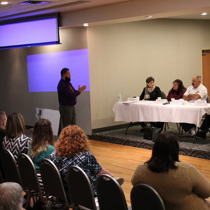 Panel in front of audience
