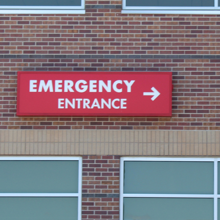 Rural hospital "emergency entrance" sign
