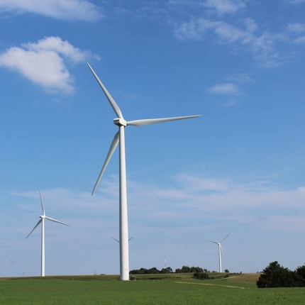 wind turbines in an open field.