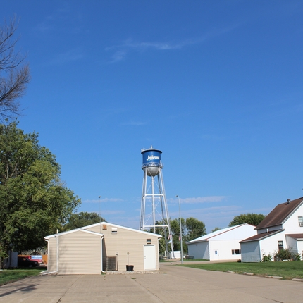 Houses with a water tower in the background.