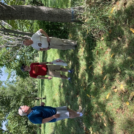 Three men at a fruit and nut farm