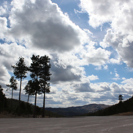 Hills and trees with clouds