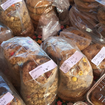 Packages of home-baked cookies at a farmers market