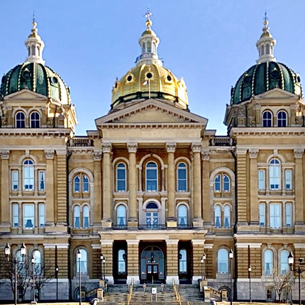 Iowa State Capitol - 3-story building with three domes, the middle one is gold.