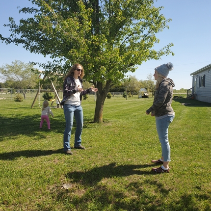two women outside talking