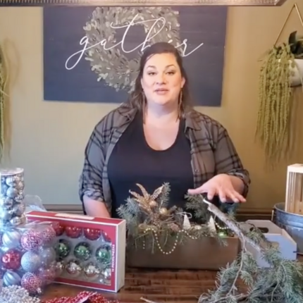 Woman demonstrating how to make centerpieces