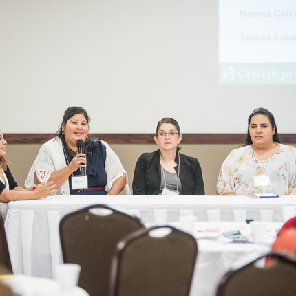 Woman speaking at conference